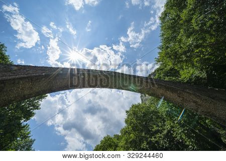 Historic Stone Arch Bridge At Zagori In Mountains In Central Greece.