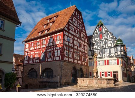 Half-timbered houses and George's spring pillar at Marktplatz (market square) in Rothenburg ob der Tauber, Bavaria, Germany, one of the most popular travel destination on Romantic Road touristic route