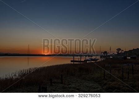 Sunrise Over A River In Petaluma Ca.