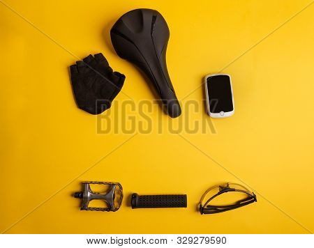 Bicycle, Cycling Accessories On The Yellow Background. View From Above