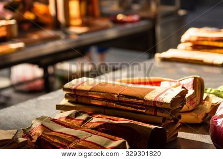 Yunlin, Taiwan - July 13th, 2019: chinese joss gold paper craft on a table at Beigang Chaotian Temple, Yunlin, Taiwan, Asia