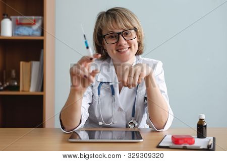 Doctor Holding In Hands A Syringe With Vaccine. Flu Shot.