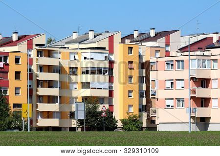 Restored Five Storey Attached Apartment Buildings With New Colorful Facades And Multiple Balconies S
