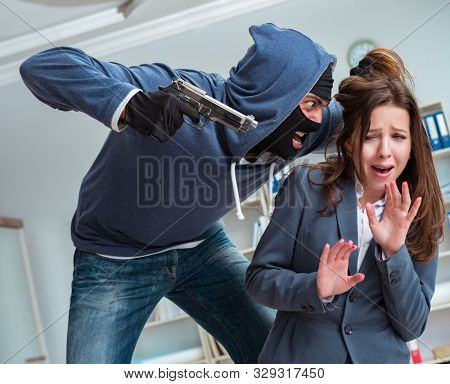 The criminal taking businesswoman as hostage in office