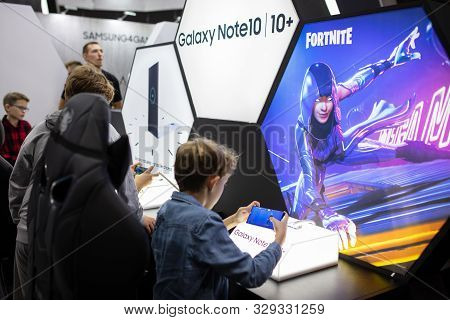 Poznan, Poland - October, 19th 2019: Boy Is Playing Fortnite Game On Samsung Phone At Pga2019. Pga20