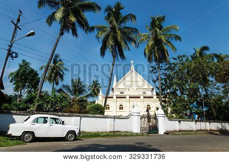 Kochi, India - 9 November 2017: White Oldtimer Car Santa Cruz Cathedral Basilica White Colonial Chur
