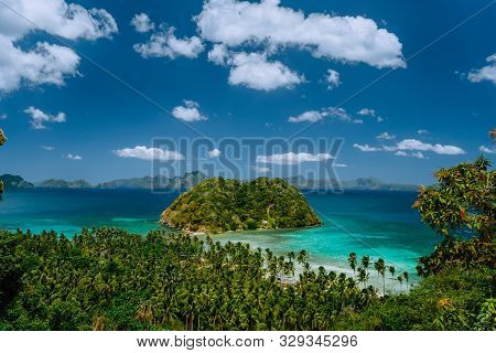 Tropical Beach Scenery With Palm Trees, Island And Blue Lagoon. El Nido, Palawan, Philippines