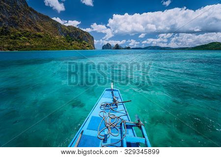 Island Hopping Tour Boat Hover Over Open Blue Ocean Water Between Exotic Karst Limestone Islands On 