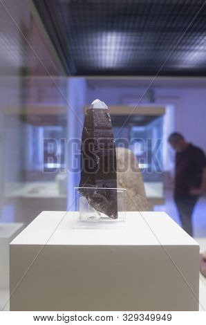 Cadiz, Spain - May 31th, 2019: Prehistoric Silex Knife. Visitor Standing At Bottom. Cadiz Museum, Sp