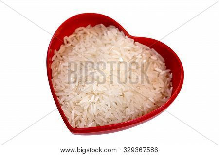 White Rice In A Heart Shaped Container With White Background