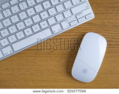 Uk, October 2019: Apple Mac Wireless Mouse And Keyboard On Wooden Desk