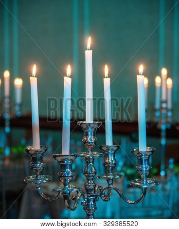 Candle holder with candles in a room