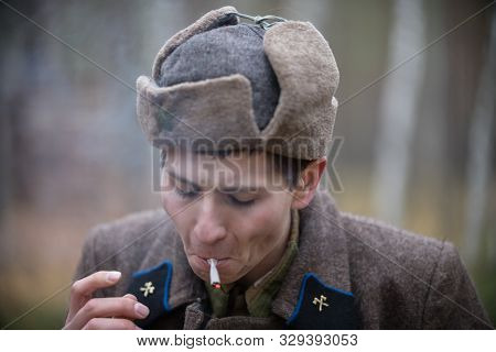 A Soldier Of World War Ii Is Pulling On A Self-roll