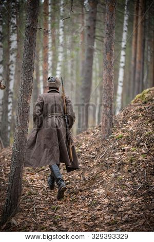 A Soldier Of World War Ii Is Going To The Forest