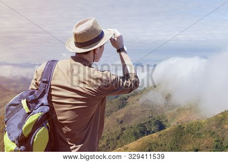 Hipster Young Travelers With Backpacks Enjoying Sunset At The Mountain