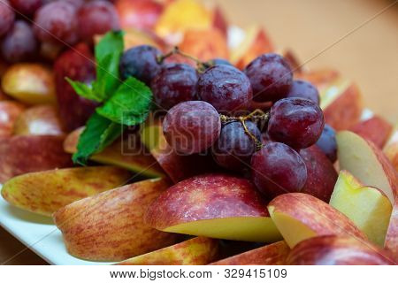 Assorted Fruit - Apples, Grapes. Sliced Fruit On A Plate