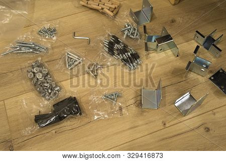 Furniture Assembly Parts And Tools For Self Assembly Furniture, On The Floor.