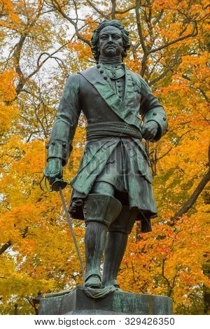 Sculpture Of Peter The Great (1841) Close-up On A Background Of Yellow Autumn Foliage. Kronstadt, Ru