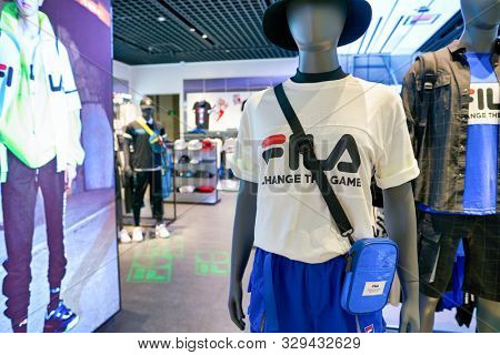 SHENZHEN, CHINA - CIRCA APRIL, 2019: clothes on display at Fila store in Shenzhen. Fila is an Italian sporting goods brand and company