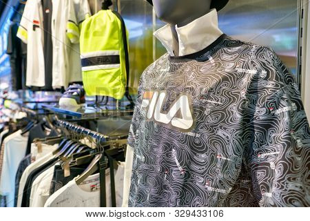 SHENZHEN, CHINA - CIRCA APRIL, 2019: clothes on display at Fila store in Shenzhen. Fila is an Italian sporting goods brand and company