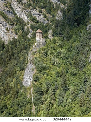 Cliff Ruins Innerjuvalt - An Old Fort On The Deep Mountain Over The Swiss Village Rothenbrunnen In C