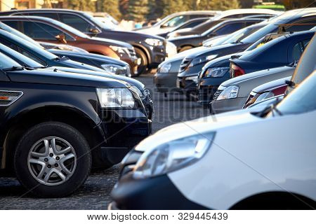 Lots Of Cars In An Open Parking Lot, Selective Focus