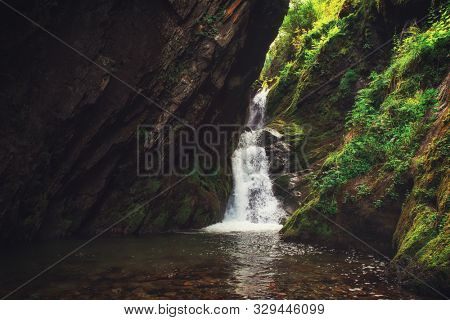 Estyube Waterfall at Lake Teletskoye in the Altai Mountains