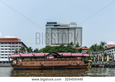 Bangkok City, Thailand - March 17, 2019: Chao Phraya River. Large Brown Ferry Docked At Private Land