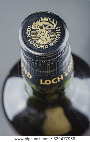 Loch Lomond Whisky On Gradient Background. Loch Lomond Distillery Is A Highland Single Malt Scotch W