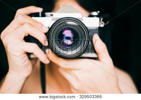 Close Up Man Taking Photos With An Old Vintage Film Camera