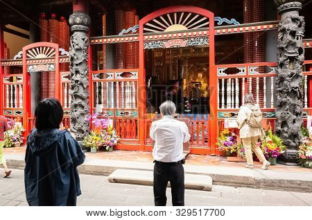 Taipei, Taiwan - October 20th, 2019: people praying in Lungshan temple at Taipei, Taiwan