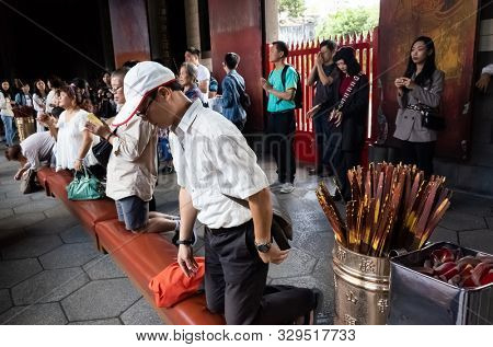 Taipei, Taiwan - October 20th, 2019: people praying in Lungshan temple at Taipei, Taiwan