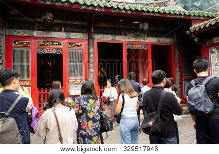 Taipei, Taiwan - October 20th, 2019: people praying in Lungshan temple at Taipei, Taiwan