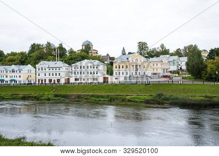 Torzhok, Russia - August 4, 2019: Panoramic Summer View Of The Embankment Of The Tvertsa River With 