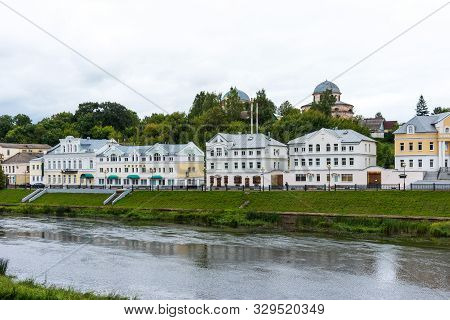 Torzhok, Russia - August 4, 2019: Panoramic Summer View Of The Embankment Of The Tvertsa River With 