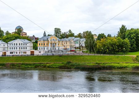Torzhok, Russia - August 4, 2019: Panoramic Summer View Of The Embankment Of The Tvertsa River With 