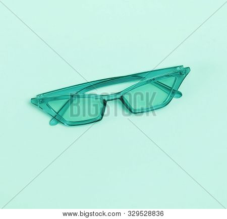 Stylish Sunglasses Isolated On The Pastel Green Or Mint Background.