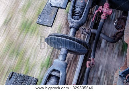 Detail Of Connection Of A Vintage Train Cars With Blurred Background While Driving.