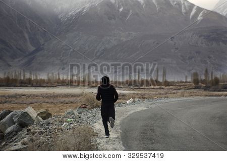 Indian Or Tibetan People Running And Jogging In Morning Time At Beside Road Of Hunder Or Hundar Vill
