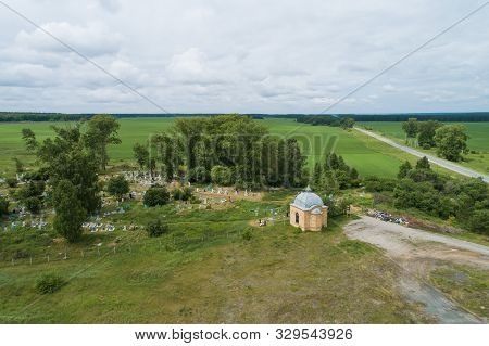 Old Chapel, Road And Cemetery Among The Trees And Fields. Aerial, Summer, Cloudy