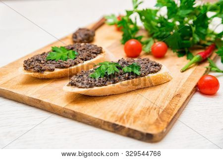 Fresh Tasty Bruschetta With Truffle Sauce, Parsley And Tomates