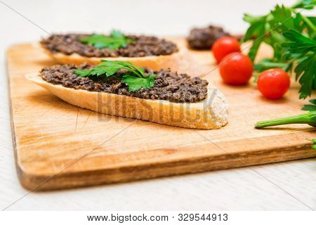 Fresh Tasty Bruschetta With Truffle Sauce, Parsley And Tomates