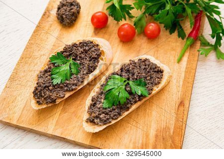 Fresh Tasty Bruschetta With Truffle Sauce, Parsley And Tomates. Top View