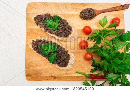 Fresh Tasty Bruschetta With Truffle Sauce, Parsley And Tomates. Top View