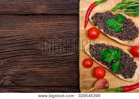 Fresh Tasty Bruschetta With Truffle Sauce, Chili, Parsley And Tomates. Top View