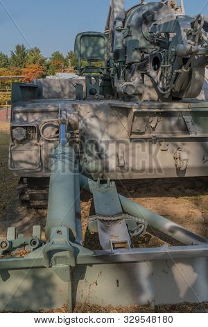 Hydraulic Recoil Spade On Rear Of Armored Military Vehicle On Display In Public Park.