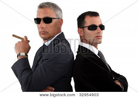 Powerful businessmen in sunglasses