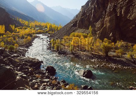 Beautiful Nature Landscape View Of Winding River Flowing Along Valley In Hindu Kush Mountain Range. 