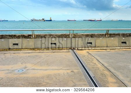 Singapore Harbor. Industrial Cargo Ships In The Background