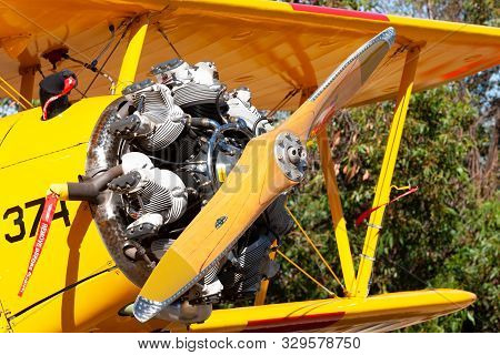 Tyabb, Australia - March 9, 2014: Vintage Biplane With A 7 Cylinder Radial Engine With A Wooden Prop